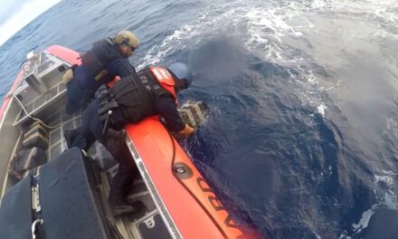 Coast Guard Boat Crew Pulls Bales Of Cocaine From The Water